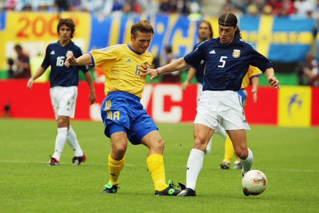 Matias Almeyda of Argentina and  Anders Svensson of Sweden
