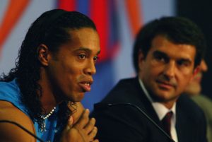 Ronaldinho of Brazil with the president of Barcelona FC Joan Laporta talking to the press