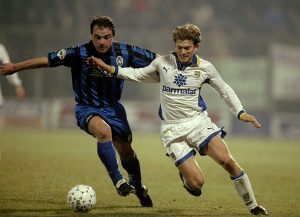 Jesper Blomqvist of Parma AC and Giovanni Pinchentini of Atalanta Bergamasca Calcio