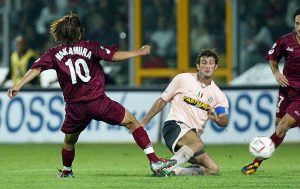 Nakamura is tackled by Ferrara