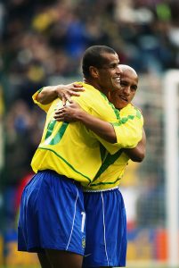 Roberto Carlos of Brazil celebrates his goal with Rivaldo of Brazil