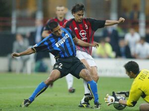 Filippo Inzaghi of AC Milan gets stopped by Ivan Cordoba of Inter Milan