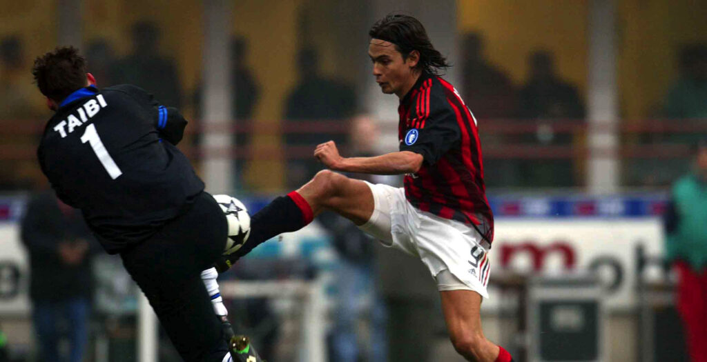 Filippo Inzaghi of AC Milan and Massimo Taibi of Atalanta in action