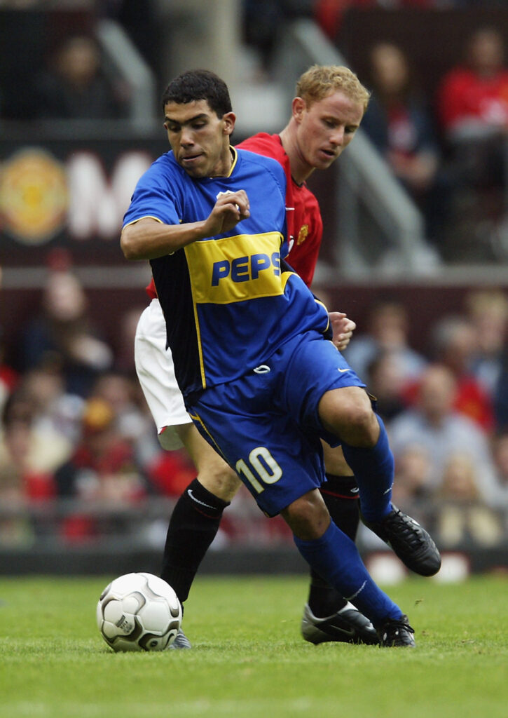 Carlos Tevez of Boca Juniors and Nicky Butt of Manchester United