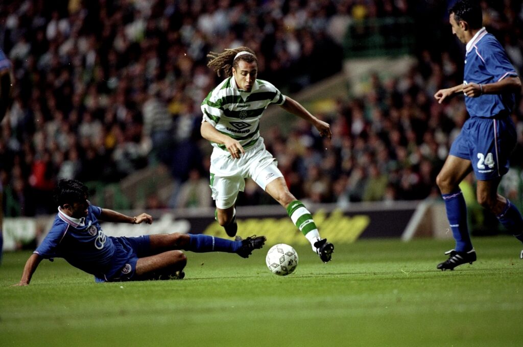 Henrik Larsson of Celtic runs with the ball