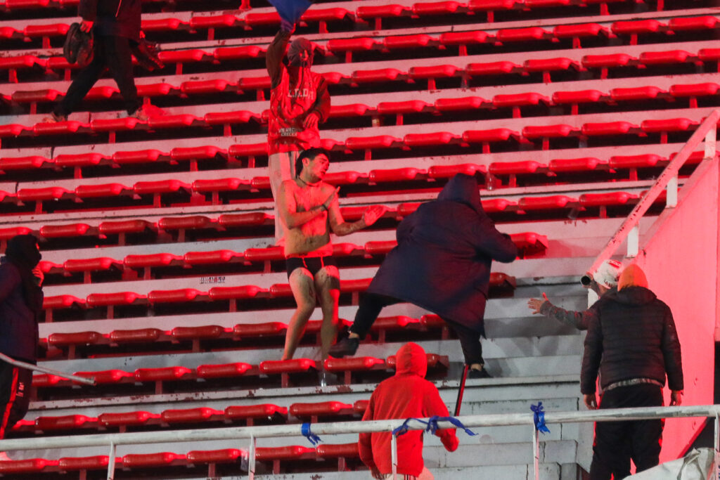 Fans of Independiente And U De Chile Clash During A Copa Sudamericana Game