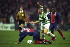 Carsten Jancker of Vienna falls over Paul Le Guen of Saint-Germain