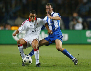 Filippo Inzaghi of AC Milan battles with Jorge Costa of FC Porto