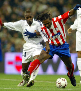 Emerson of Atletico Madrid and Claude Makelele of Real Madrid  in action