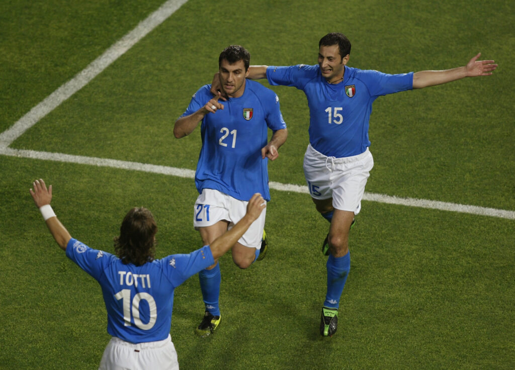 Francesco Totti and Mark Iuliano of Italy congratulate team-mate Christian Vieri after he scored the opening goal of the match